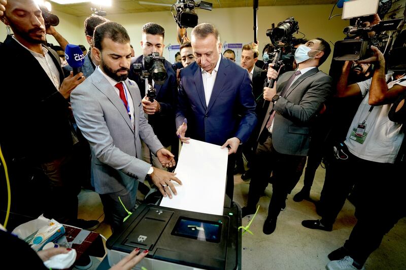 Iraqi Prime Minister Mustafa Al Kadhimi casts his vote in the Green Zone, Baghdad. Photo: Reuters