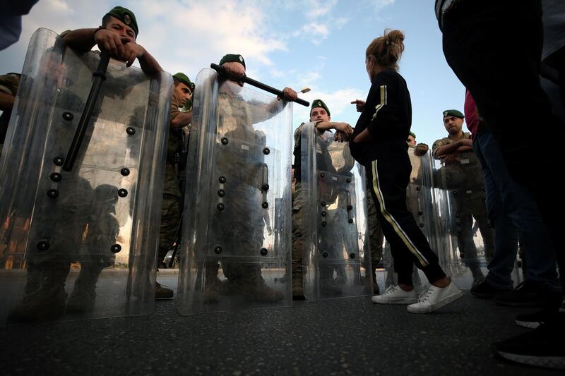 Lebanese army soldiers stand guard during ongoing anti-government protests in the port city of Sidon, Lebanon. Reuters