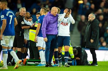 A distraught Son Heung-min leaves the pitch after being sent off for Tottenham against Everton. EPA