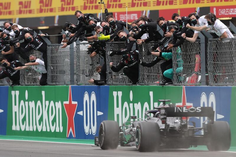 Lewis Hamilton crosses the finish line to win the Portuguese Grand Prix. AFP