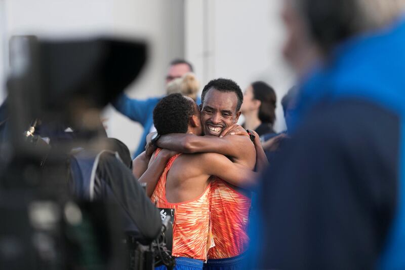 DUBAI, UNITED ARAB EMIRATES - Jan 26, 2018. 

Mosinet Geremew,left, led an Ethiopian sweep of the top 10 in the Dubai Marathon in a new course record time of 2 hours and 4 minutes on Friday morning at the Standard Chartered Dubai Marathon. 

(Photo by Reem Mohammed/The National)

Reporter: Amith
Section: NA + SP