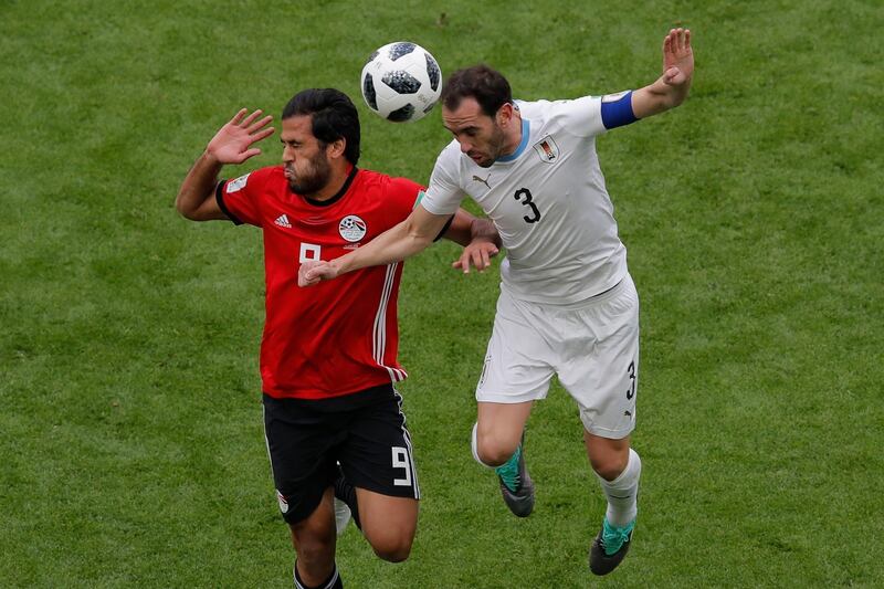 Uruguay's Diego Godin, right, jumps for the ball with Egypt's Marwan Mohsen during their group A match at the 2018 FIFA World Cup at the Yekaterinburg Arena in Yekaterinburg, Russia, on June 15, 2018. Vadim Ghirda / AP Photo