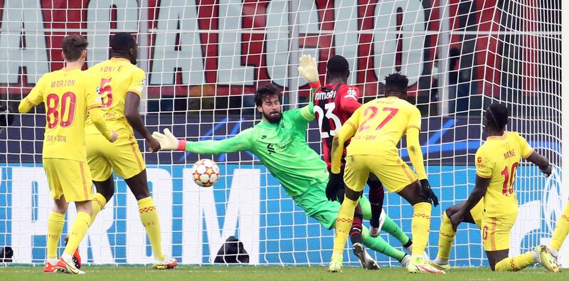 AC Milan's Fikayo Tomori (C) scores the opening goal against Liverpool. EPA
