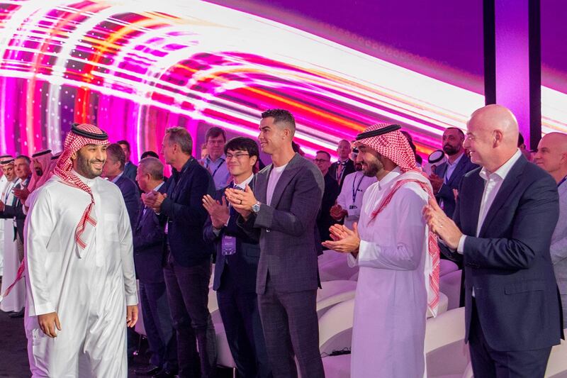 Saudi Crown Prince Mohammed bin Salman is greeted by Fifa president Gianni Infantino and Al Nassr's Portuguese forward Cristiano Ronaldo at the launch of the Esports World Cup in Riyadh. AFP
