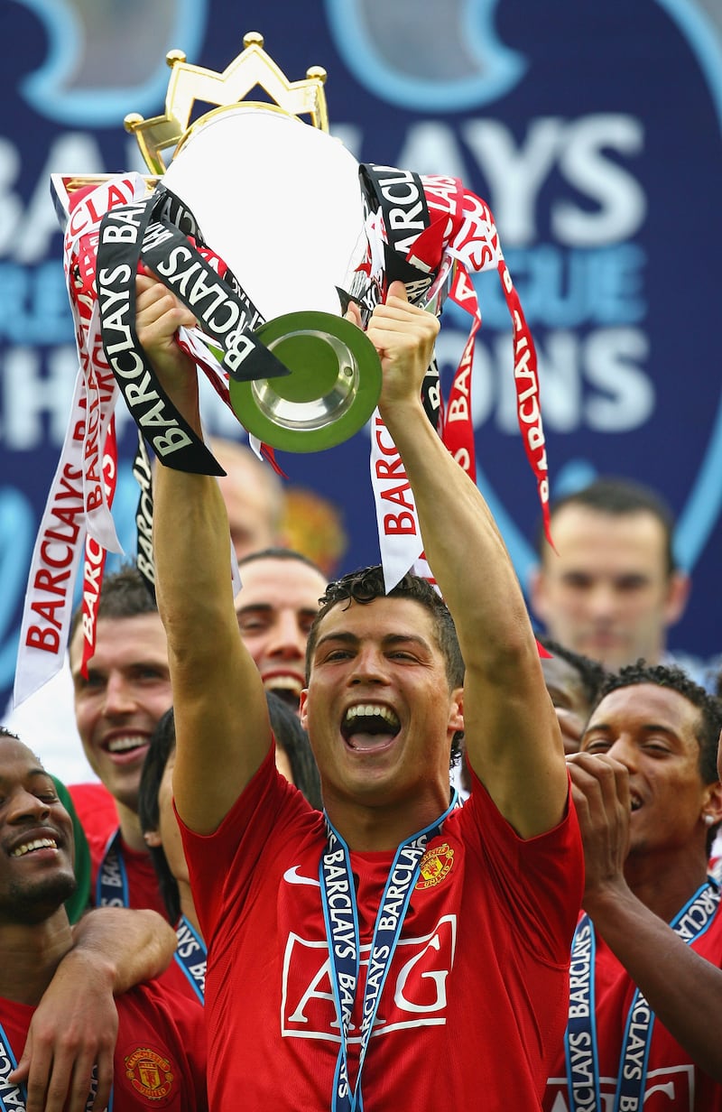 Cristiano Ronaldo lifts the Premier League trophy with his Manchester United teammates in 2008. Getty Images