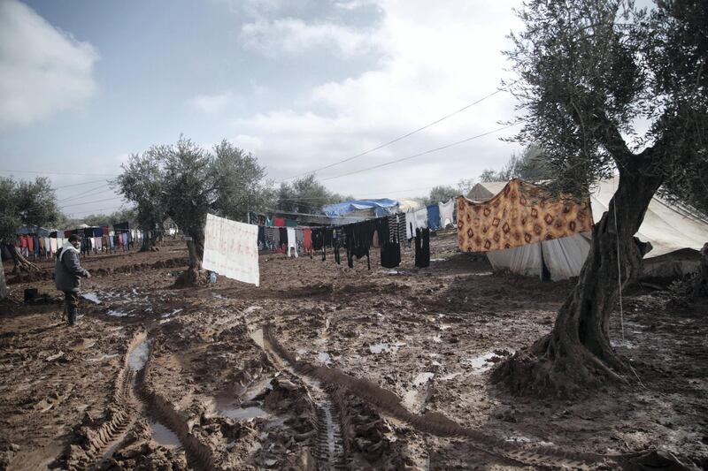 Location: Al-Karama camp in Atama. The aftermath of heavy rainfall on north Syria, residents lost their furniture, clothes and bedding as well as the tents waiting outside in open lands until the civil defense and NGs arrive to rescue them.