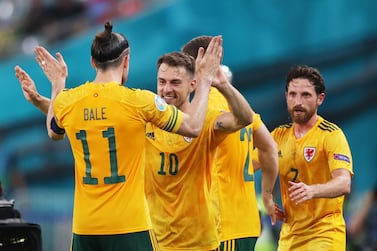 Aaron Ramsey celebrates with Gareth Bale after scoring Wales' first goal against Turkey. Getty 