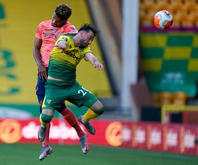 Norwich City's Josip Drmic and Mason Holgate of Everton challenge for a header. AP
