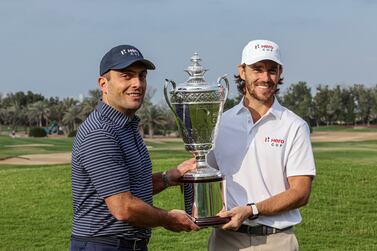 Italian Francesco Molinari (L), captain of Continental Europe team, and British Tommy Fleetwood, captain of Great Britain and Ireland team, pose with the trophy during a press conference for the Hero Cup golf tournament in Abu Dhabi, United Arab Emirates, 11 January 2023.  The Hero Cup golf tournament will run from 13 till 15 January 2023.   EPA / ALI HAIDER
