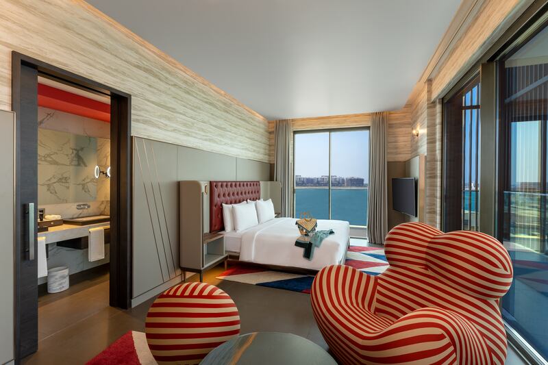 A deluxe king room with sea view and balcony.
