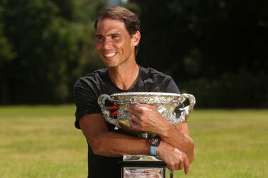 Men's singles champion Rafael Nadal of Spain poses for a photo with his trophy at Government House after the Australian Open in Melbourne, Australia, Monday, Jan.  31, 2022.  (AP Photo / Hamish Blair)