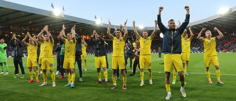 Ukraine players celebrate after their 3-1 win against Scotland in the World Cup 2022 qualification playoff semi-final at Hampden Park in Glasgow. EPA