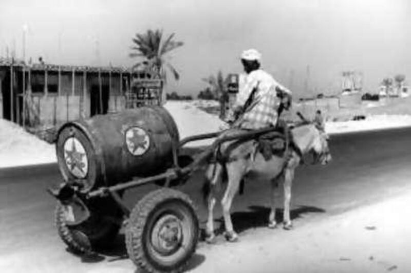 Archive image entitled 'One barrel of Caltex oil, Jumeirah Beach Road' (1975), taken by Anita Van der Krol. The photo is one of a number of images to be exhibited at the 'Old Dubai' exhibitiontaking place from the 15th June until thew 15th July at Gallery One in Khan Murjan Souk at The Wafi City, Dubai. Courtesy Gallery One

REF al00dubaiphoto