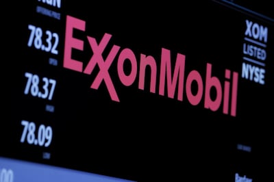 The logo of Exxon Mobil Corporation is shown on a monitor above the floor of the New York Stock Exchange. Reuters