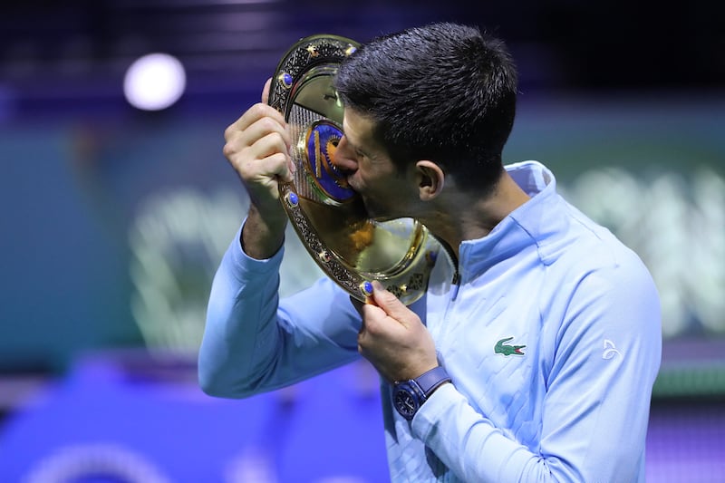 Serbia's Novak Djokovic kisses the trophy. Reuters