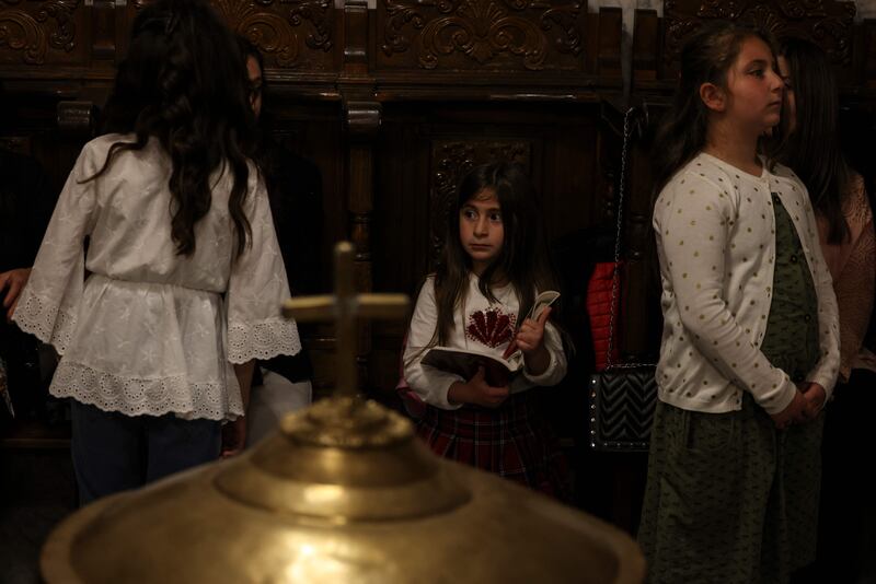 Palestinian Christians attend an Orthodox service during Easter night in Gaza City. AFP
