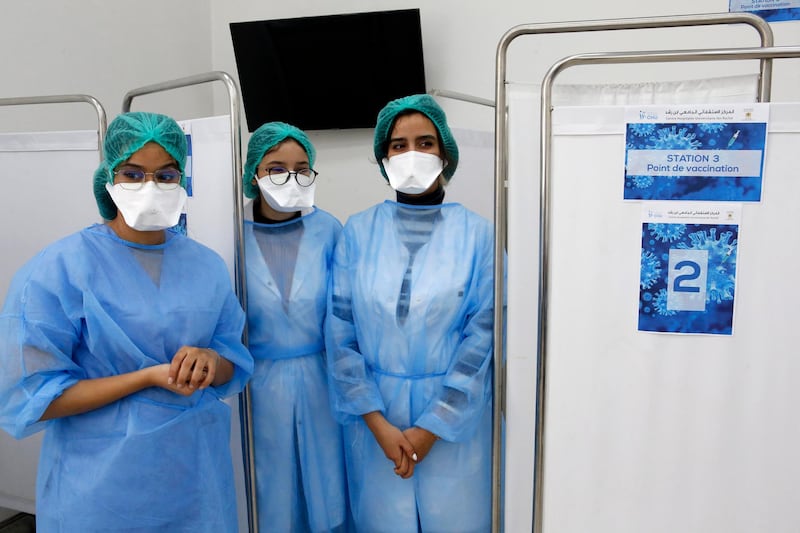 Moroccan nurses wait inside a vaccination booth in Casablanca. AP Photo