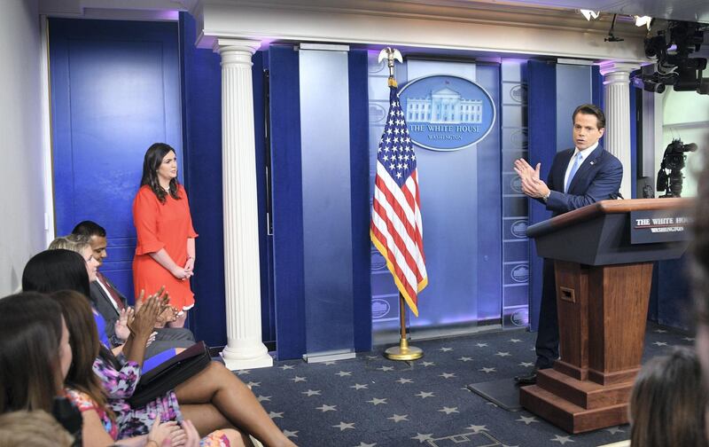 Anthony Scaramucci, named Donald Trump's new White House communications director speaks as new White House press secretary Sarah Huckabee Sanders looks on during a press briefing at the White House in Washington, DC on July 21, 2017. - Anthony Scaramucci, named Donald Trump's new White House communications director, is a millionaire former hedge fund investor who shores up the stable of bankers in the president's inner circle.It is the first administration role for the 53-year-old Republican fundraiser with telegenic looks who has long been an articulate surrogate for the president and who was first named to his transition team last November. (Photo by JIM WATSON / AFP)