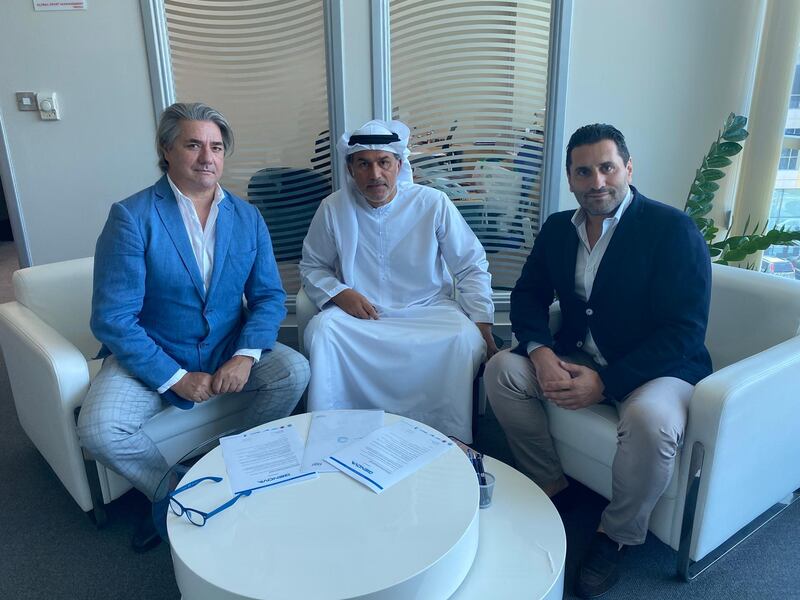 Nasser Al Tamimi, board member of the Racing City Group, is flanked by film producer Paolo Odierna, left, and Morris Pagniello, founder of Genova International Soccer Academy. Courtesy Racing City Group