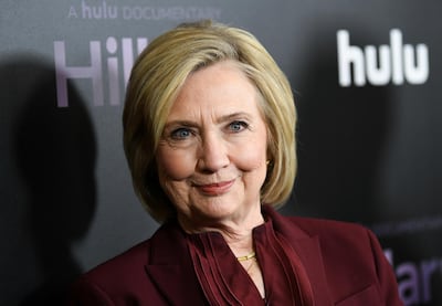 FILE - This March 4, 2020 file photo shows former secretary of state Hillary Clinton at the premiere of the Hulu documentary "Hillary" in New York. A virtual coffee with Clinton is one of the offerings in an online auction presented by famed auction house Sothebyâ€™s using Google Meet video calls. The event will be held May 1-8 and will benefit the International Rescue Committee's efforts to combat COVID-19. (Photo by Evan Agostini/Invision/AP, File)