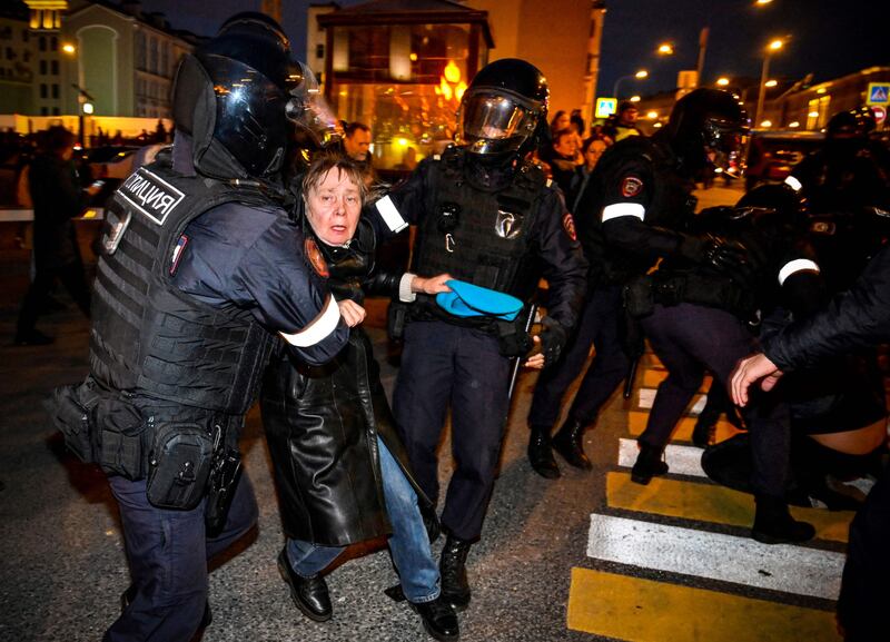 A woman protester is detained during a demonstration in Moscow. AFP