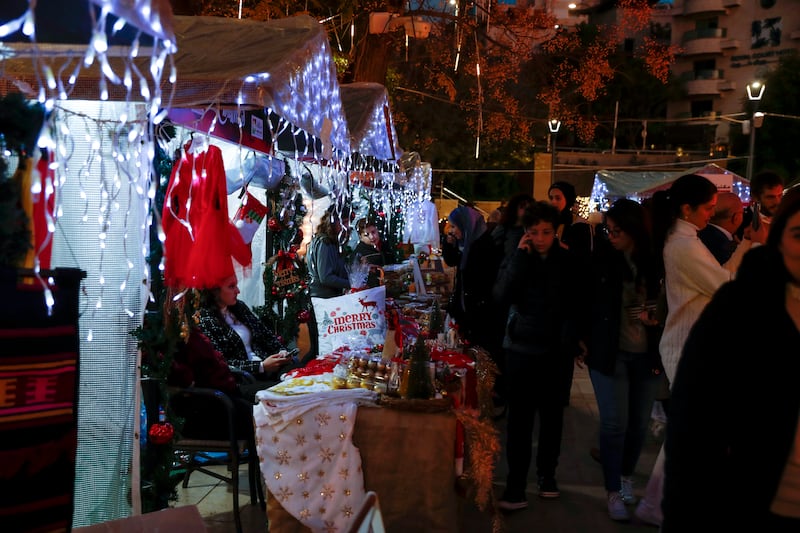 Palestinians visit the Christmas market in the West Bank city of Ramallah, marking the beginning of festive celebrations in the city