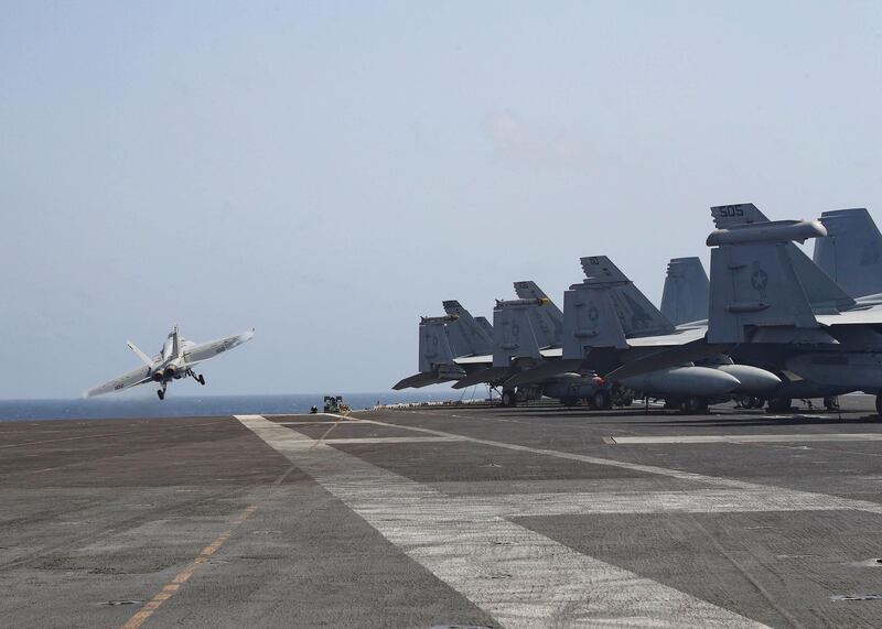 An F/A-18E Super Hornet from the 'Pukin' Dogs' of Strike Fighter Squadron (VFA) 143 launching from the flight deck of the Nimitz-class aircraft carrier USS Abraham Lincoln (CVN 72), in the Arabian Sea.  EPA