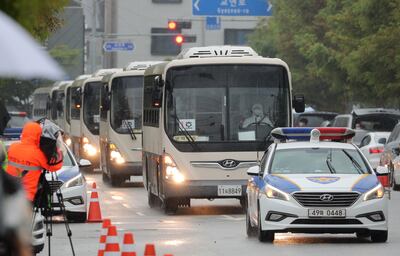 Buses carrying Afghan evacuees arrive in Jincheon. EPA