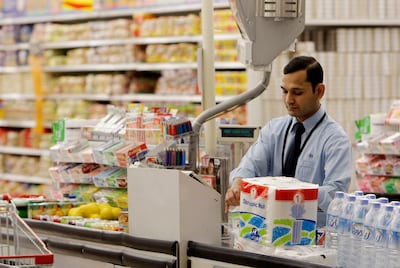 DOHA, QATAR - February 19, 2009: A cashier at Carrefour in the City Centre - Doha, shopping mall.
( Ryan Carter / The National )

stock, shopping, shop, groceries *** Local Caption ***  RC008-ShoppingQatarB.JPGRC008-ShoppingQatarB.JPG