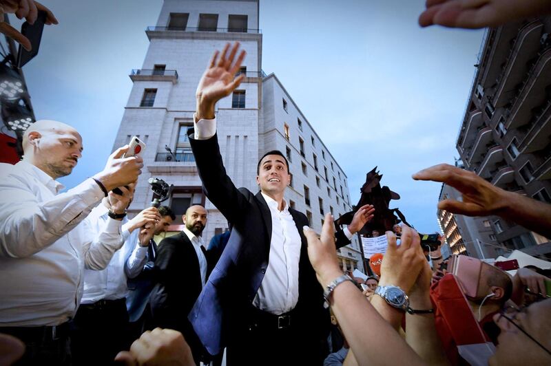epa06771840 Five-Stars Movement (M5S) leader Luigi Di Maio (C) cheers with supporters during a meeting in Naples, Italy, 29 May 2018. Di Maio the previous day called for mass mobilisation in support of the party's bid to impeach President Sergio Mattarella the day after Mattarella refused to approve populist leaders' choice of an economy minister - namely Paolo Savona - who has expressed anti-euro views because the appointment would have 'alarmed markets and investors, Italians and foreigners. Mattarella spoke to reporters after Premier-Designate Giuseppe Conte, who was proposed as Prime Minister by Right-wing populist Lega and the populist Five Star Movement (M5S), announced that he did not succeed in forming what would have been Western Europe's first populist government.  EPA/CIRO FUSCO