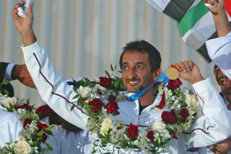 Sheikh Ahmed Mohammed Hasher al Maktoum displays his medal after winning the UAE's first ever gold in 2004