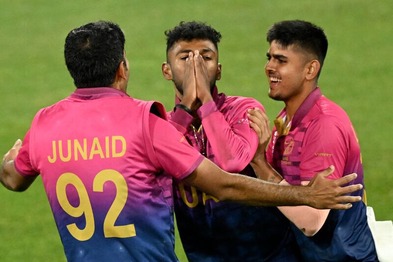 Karthik Meiyappan celebrates his hat-trick with teammates Junaid Siddique and Aryan Lakra in Geelong. AFP