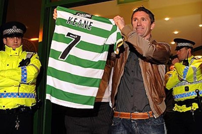 Robbie Keane holds up his shirt to the crowd outside Parkhead on Monday night.