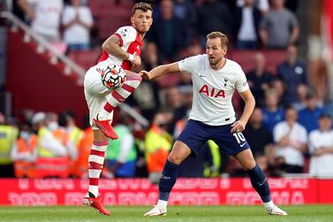 Arsenal's Ben White (left) and Tottenham Hotspur's Harry Kane battle for the ball during the Premier League match at the Emirates Stadium, London. Picture date: Sunday September 26, 2021.