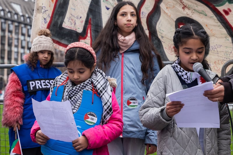 Children read out statements at an event organised at Parliament Square by Parents for Palestine as part of National School Strike for Palestine activities. Getty Images