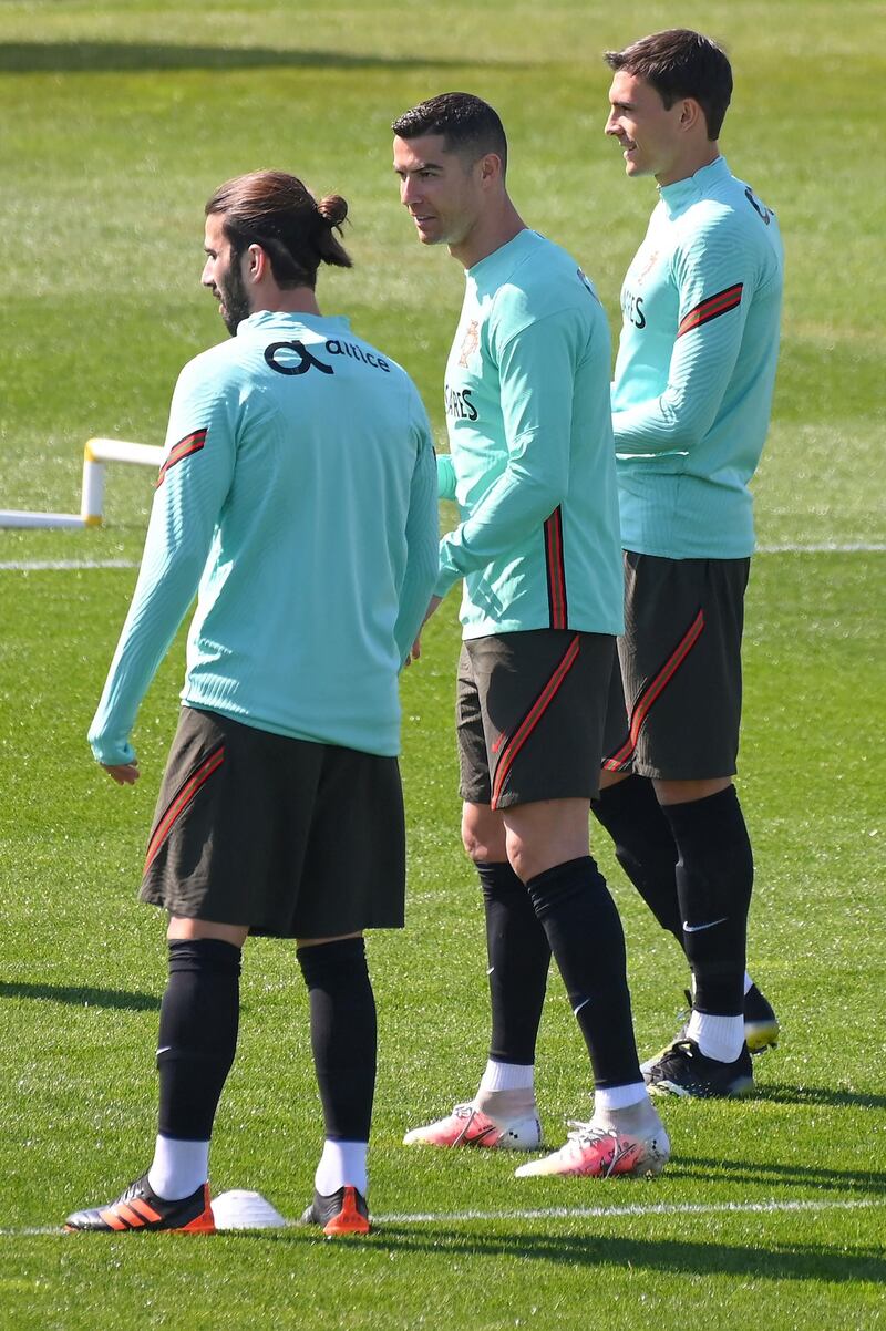 Portugal's Cristiano Ronaldo and midfielder Sergio Oliveira. AFP