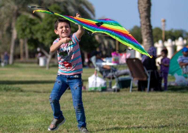 Abu Dhabi, United Arab Emirates, December 13, 2019.  
  -- Zeid El Kakoun flies his rainbow kite at Dolphin Park, Eastern Mangrove.
Victor Besa/The National
Section:  NA
Reporter: