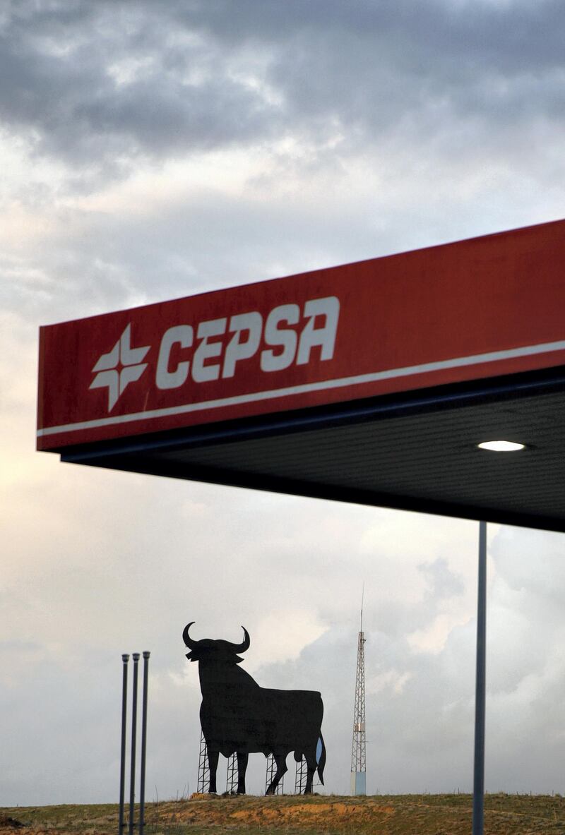 A giant billboard made in the shape and size of a bull, known as 'Osborne's Bull', can be seen behind a Cepsa petrol station in Cabezas de San Juan, near Seville, in southern Spain, March 22, 2016. REUTERS/Andrea Comas - D1AESUISYKAA