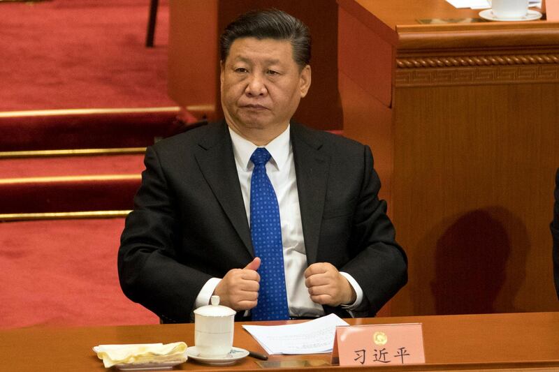 In this Saturday, March 3, 2018, photo, Chinese President Xi Jinping attends the opening session of the Chinese People's Political Consultative Conference in Beijing's Great Hall of the People. Xi is poised to make a historic power grab as China's legislators gather from Monday and prepare to approve changes that will let him rule indefinitely and undo decades of efforts to prevent a return to crushing dictatorship. (AP Photo/Ng Han Guan)