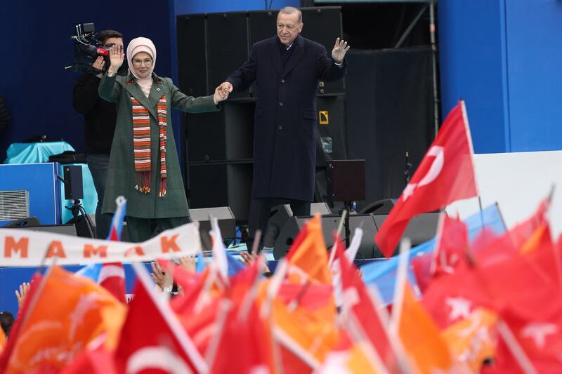 Mr and Mrs Erdogan wave to supporters. AFP