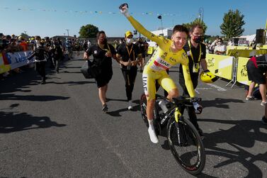 Slovenia's Tadej Pogacar, wearing the overall leader's yellow jersey, celebrates after the twentieth stage of the Tour de France cycling race, an individual time-trial over 30. 8 kilometers (19. 1 miles) with start in Libourne and finish in Saint-Emilion, France,Saturday, July 17, 2021.  (Tim van Wichelen / Pool Photo via AP)