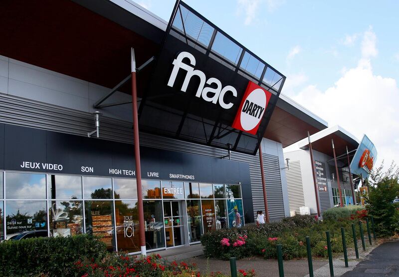 the logos of reatialers Fnac and Darty are pictured in Biganos, southwestern France, Tuesday, Aug.8, 2017. Artemis, the holding company of France's Pinault family, has sold its stake in French retailer Fnac-Darty to Germany's Ceconomy(AP Photo/Bob Edme)