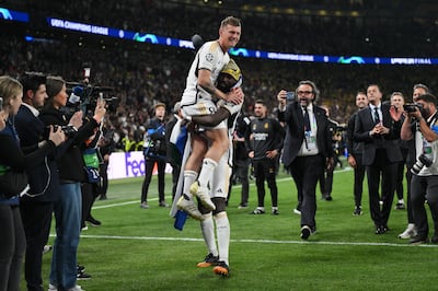 Toni Kroos of Real Madrid is lifted by teammate Antonio Ruediger after full-time. Getty