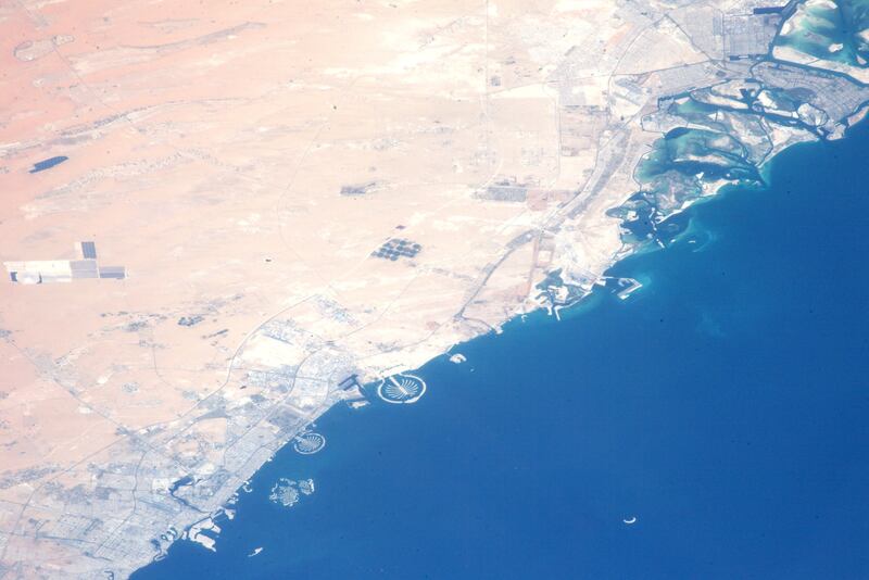 The images show the The Palm Jumeirah, Palm Jebel Ali, Deira Island and the World Islands, as well as the UAE's capital, Abu Dhabi, on the far right. Photo: Wakata Koichi