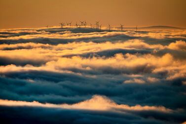 Wind turbines stand are surrounded by fog and clouds in the Taunus region near Frankfurt, Germany. AP Photo