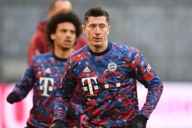 Soccer Football - Bundesliga - Bayern Munich v 1.  FSV Mainz 05 - Allianz Arena, Munich, Germany - December 11, 2021 Bayern Munich's Robert Lewandowski during the warm up before the match REUTERS/Andreas Gebert DFL REGULATIONS PROHIBIT ANY USE OF PHOTOGRAPHS AS IMAGE SEQUENCES AND/OR QUASI-VIDEO. 