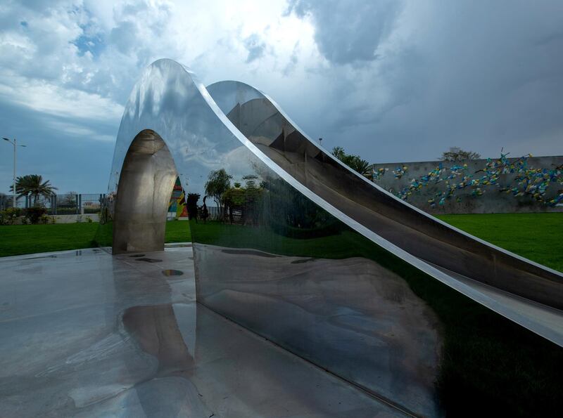 Puddles from the brief rainshowers gather on an art sculpture at the Manarat Al Saadiyat Park in Saadiyat Island on April 28, 2021.  Victor Besa / The National.