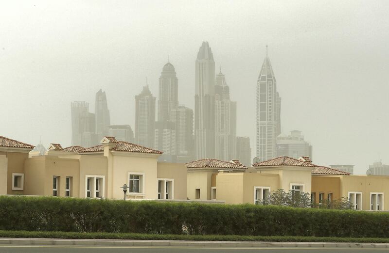 DUBAI , UNITED ARAB EMIRATES , January 19 – 2019 :- View of the Jumeirah Lake Towers and Jumeirah Park during the cloudy , dusty and windy weather in Dubai. (Pawan Singh / The National ) For News/Online/Instagram.