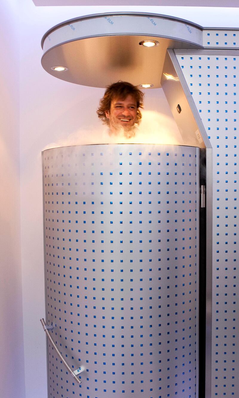 DUBAI, UNITED ARAB EMIRATES,  JULY 07, 2013. Journalist Neil Vorano tries out the newly launched Cryo full body treatment at the Cryo Health Spa Dubai, located in the Emirates Towers Boulevard. Taking him through the treatment is Benny Parihar, Partner of Cryo Health. (ANTONIE ROBERTSON / The National) Journalist Neil Vorano *** Local Caption ***  al17jl-Cryo-1.jpg