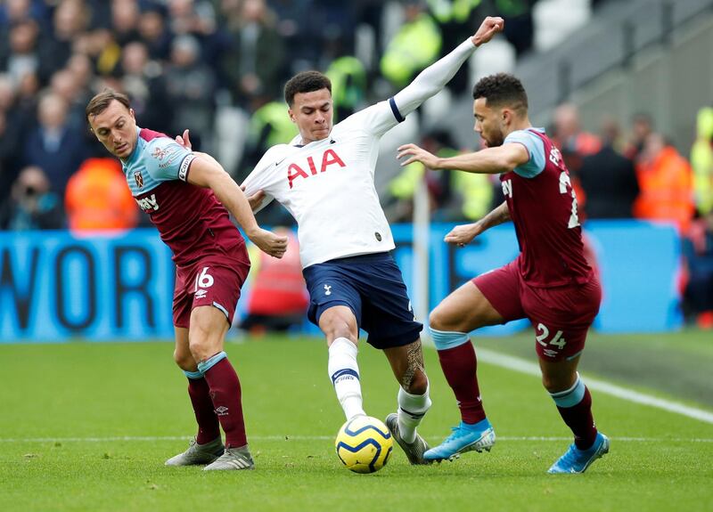 West Ham United's Mark Noble and Ryan Fredericks in action with Tottenham Hotspur's Dele Alli. Reuters